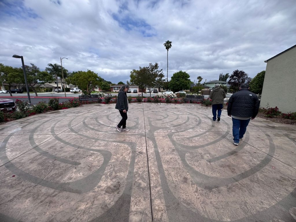 Visitors walking the Catholic prayer labyrinth at Santa Teresa Church in San Jose for meditation and reflection